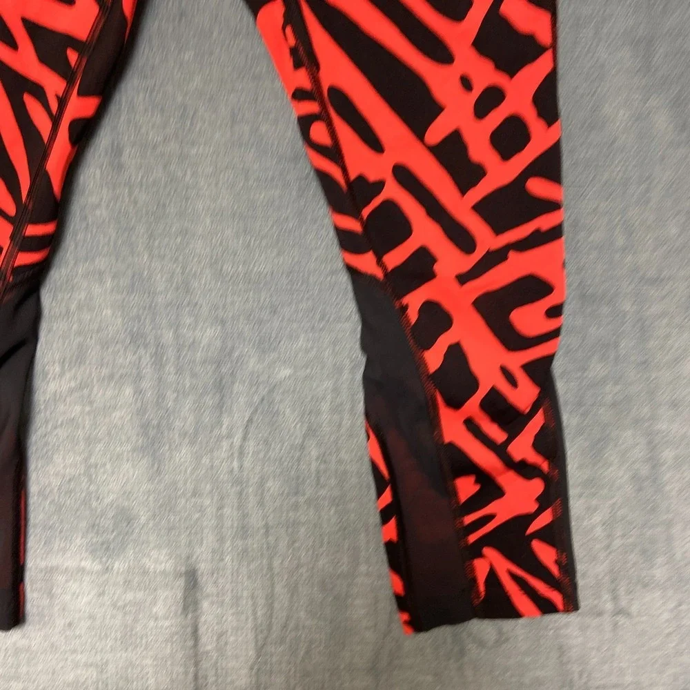 Nike Dri Fit Power Epic Lux Capri Leggings Womens XS Black Orange Abstract Print
